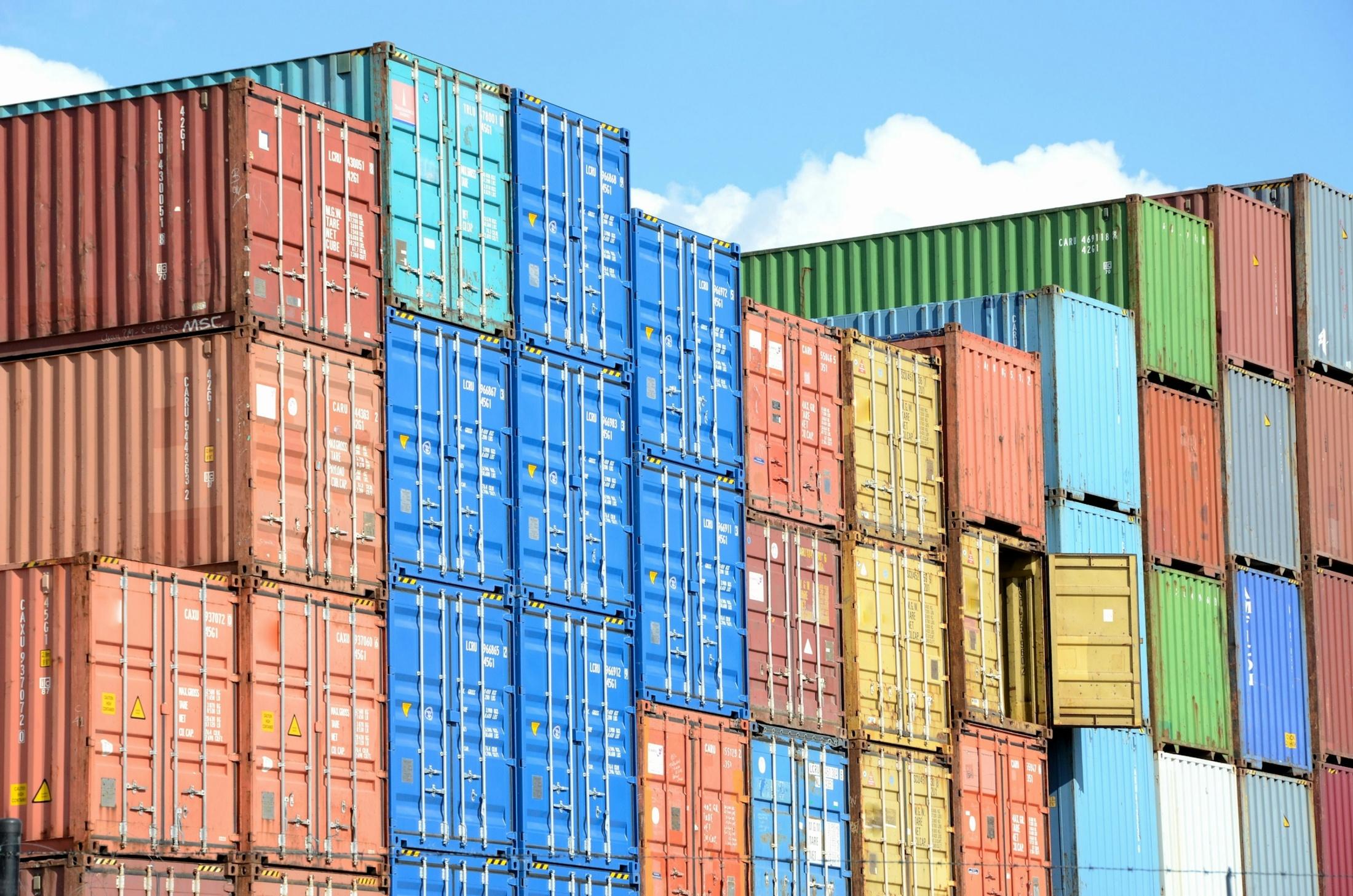 Shipping containers at export port, representing global trade from Gujarat